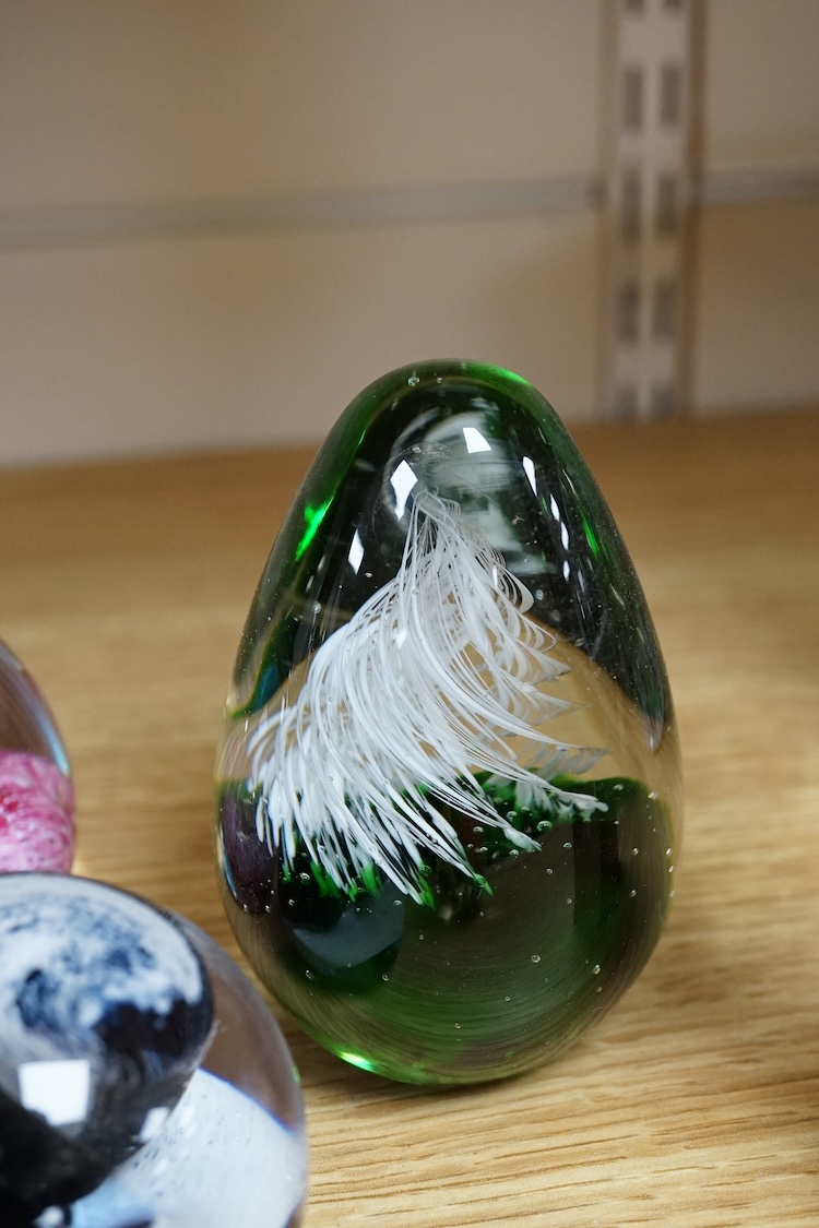 A collection of glass paperweights to include Caithness and millefiori examples, largest 10cm high